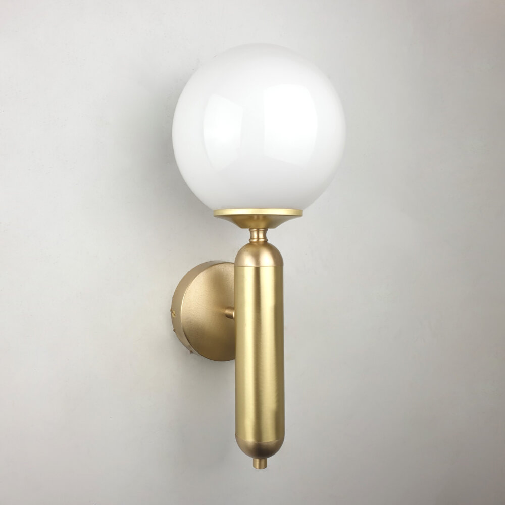 pillar satin brass wall light with opal glass globe