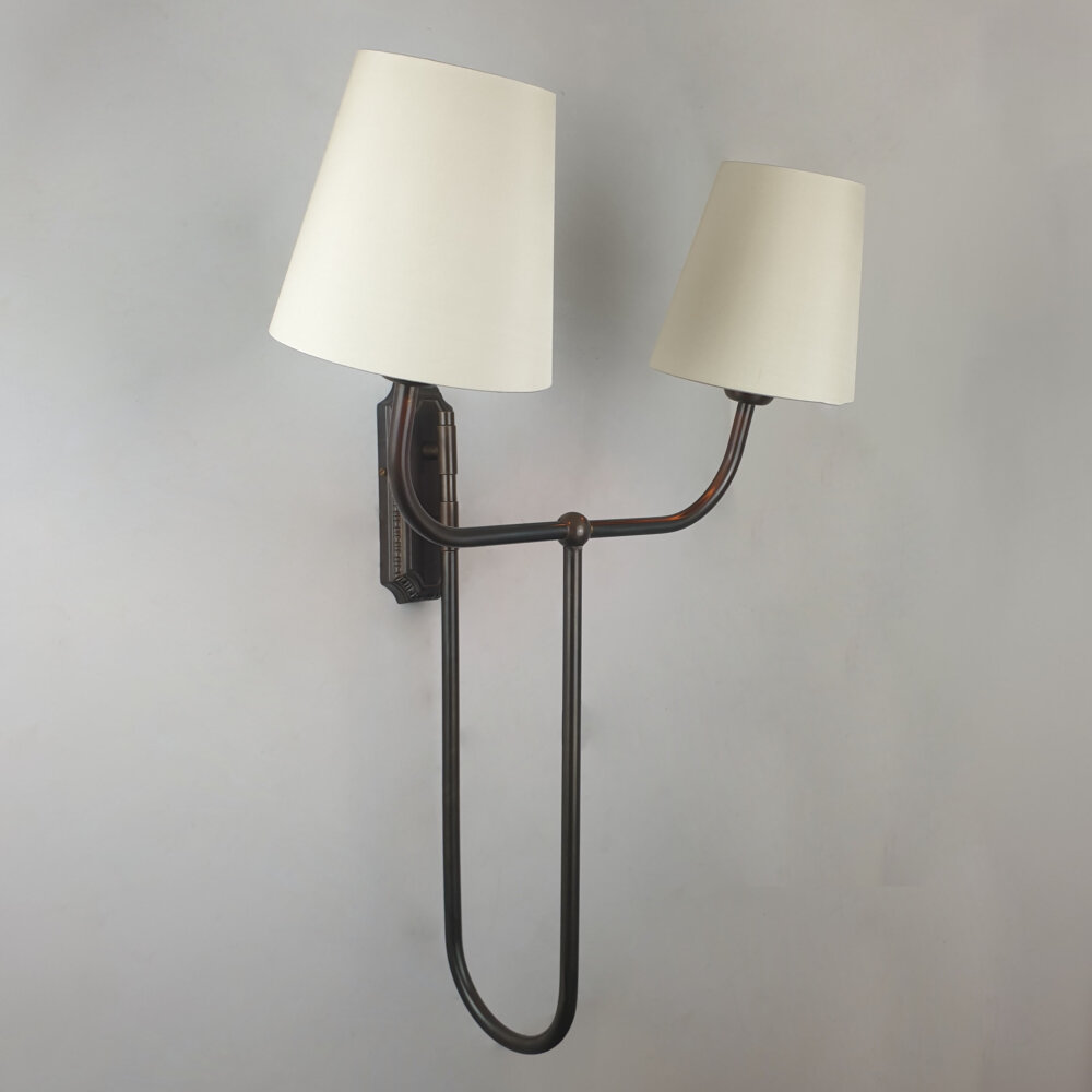 brass twin arm curved wall light with fabric shades