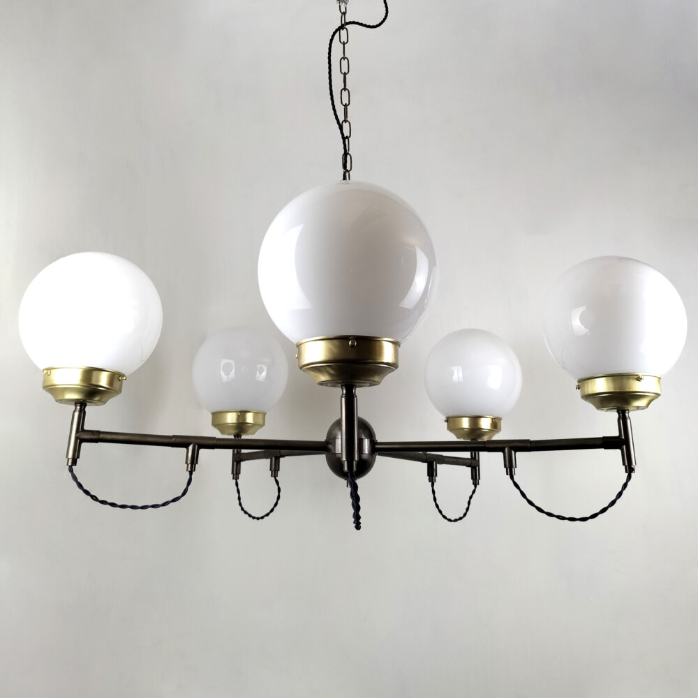 five arm brass chandelier with exposed flex opal glass globe