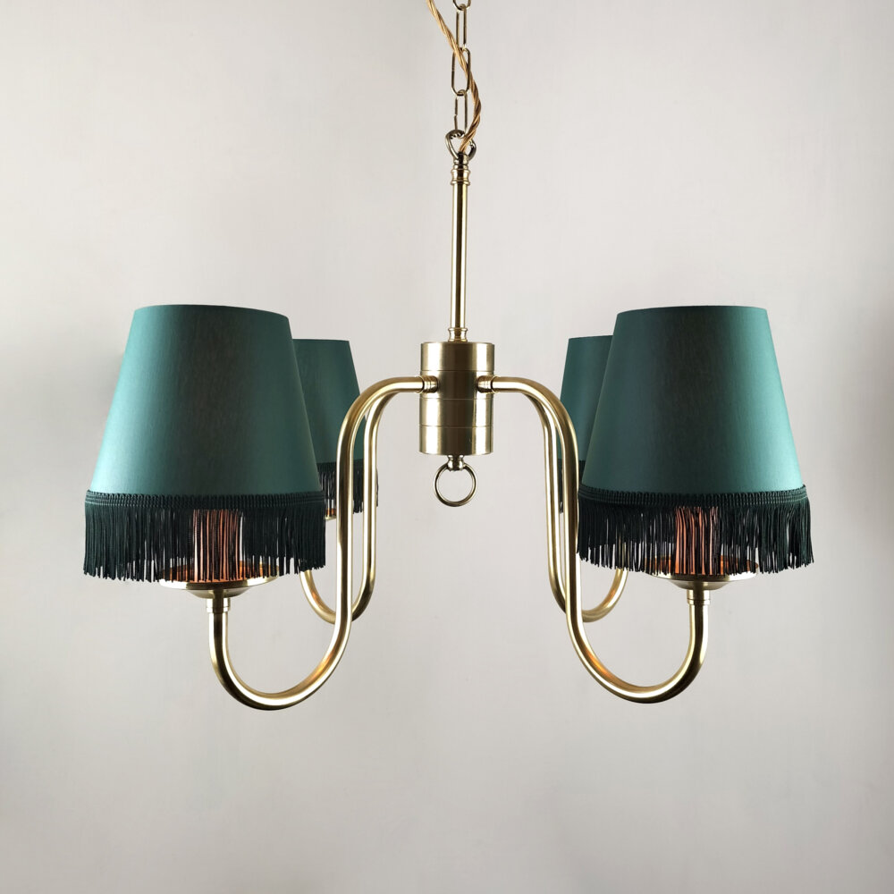 four arm brass chandelier with green tassle shades