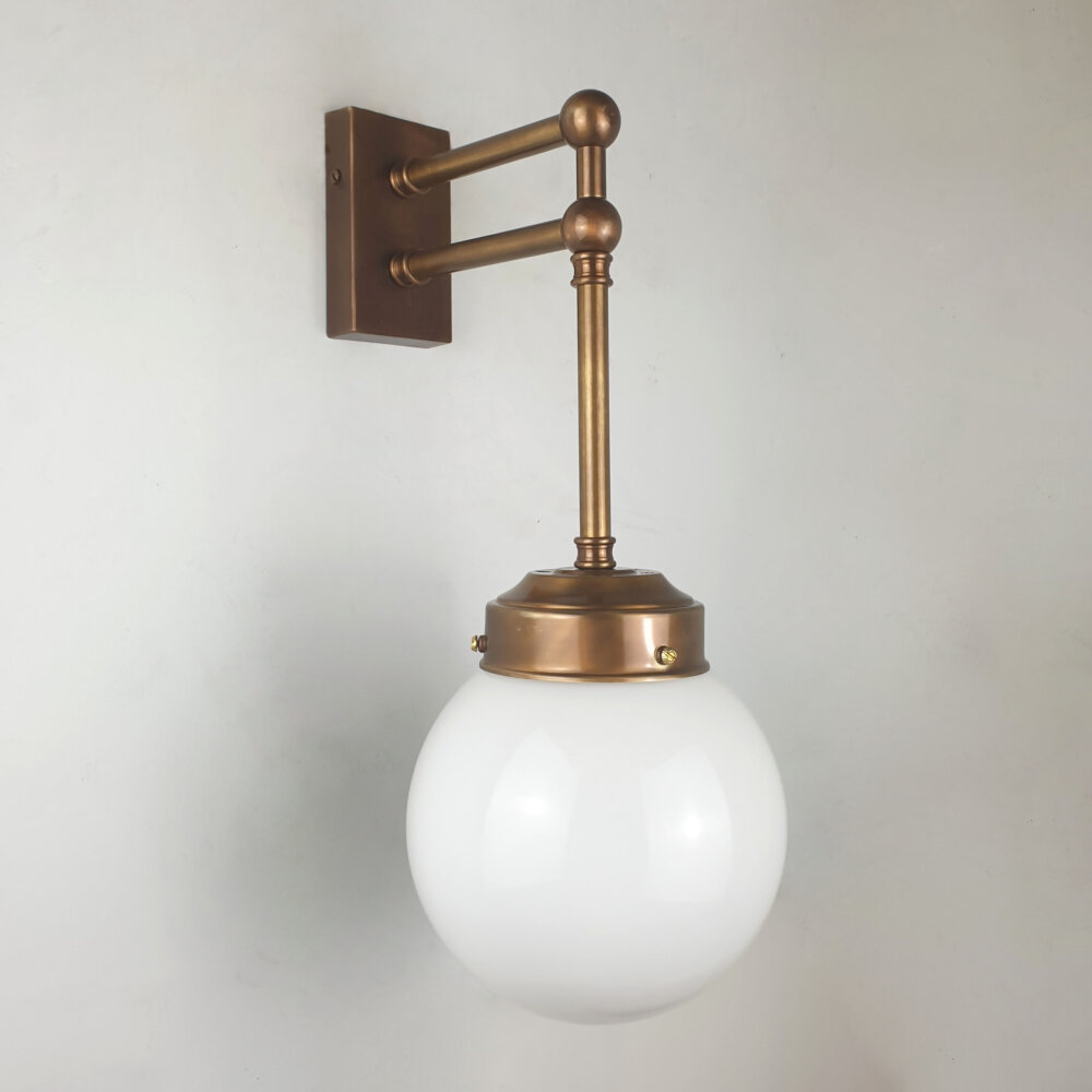 double arm detail brass wall light with opal globe